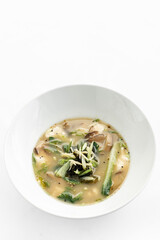 japanese miso soup with tofu, shiitake mushrooms, bok choy and seaweed