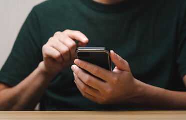 Businessman using smartphone for business and find online sales information, ideas for doing business online. Work using mobile phone typing computer mobile chat. Shopping. rate the service