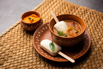 Idly lollipop or idli candy with stick served with sambar and chutney,South indian breakfast