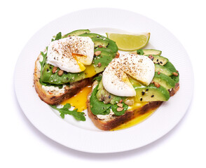 Freshly made poached egg and Avocado toasts isolated on white background