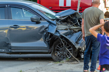 a wrecked car at the scene of a traffic accident