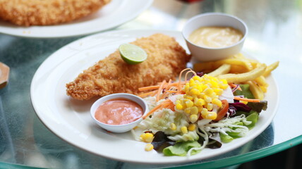 fish steak salad french fries lunch