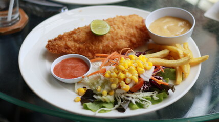 fish steak salad french fries lunch