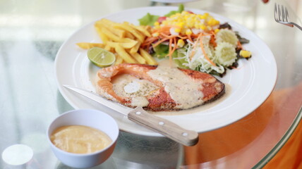 fish steak salad french fries lunch and vegetables