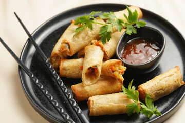 Traditional southeast asian starter dish spring or summer rolls - deep fried dim sum dumplings...