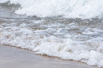 View of tiny Mediterranean sea waves. Summer vacation concept.