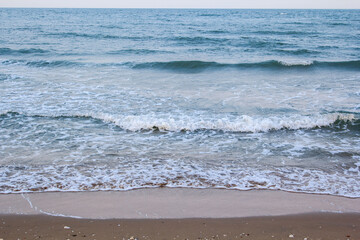 strong wind and ocean waves hit the shore. In the evening, the sea floor was blue, alternating with the grit of sand for a period that nature created, beautiful and scary.