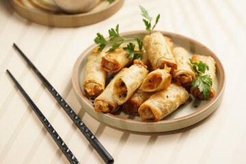 Traditional southeast asian starter dish spring or summer rolls - deep fried dim sum dumplings...
