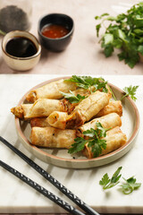 Traditional southeast asian starter dish spring or summer rolls - deep fried dim sum dumplings...