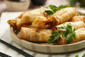 Traditional southeast asian starter dish spring or summer rolls - deep fried dim sum dumplings...