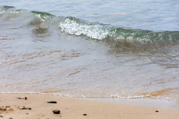 View of tiny Mediterranean sea waves. Summer vacation concept.