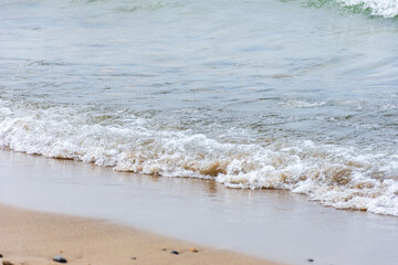 View of tiny Mediterranean sea waves. Summer vacation concept.
