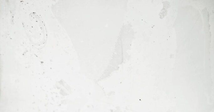 Old film overlay. Dust noise texture. Distressed layer. Daguerreotype effect. Black grain dirt stains defect flow motion on white abstract grunge background.
