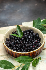 Maqui berries Superfoods antioxidant of indian mapuche. vertical image. top view. place for text