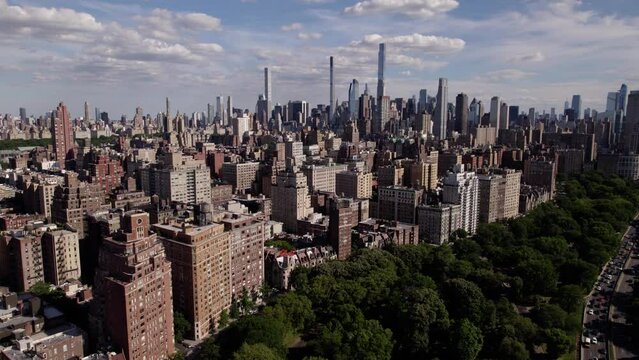 Aerial view around high-rise on the Upper West Side of Manhattan, sunny New York - circling, drone shot