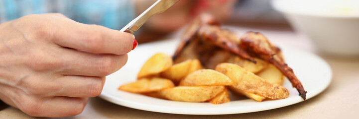 Person having breakfast or lunch in cafe or restaurant, hold knife and fork