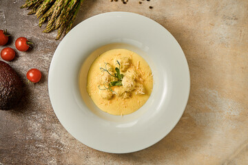 Chicken meatballs in cheese sauce. Close-up. Selective focus. Noise in post-production