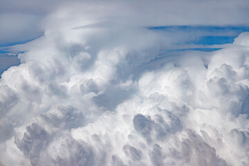 Clouds from above. View from airplane.  blue sky view from plane. sky wallpaper with space for your text . Aerial view of the blue sky. High in the Heavens.   View from Airplane Window