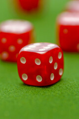 Red dice on the green table