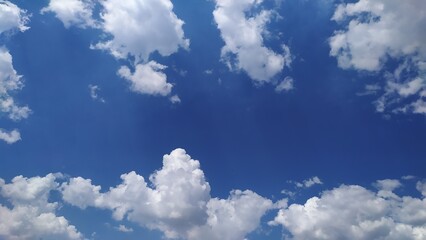 Naklejka na ściany i meble photo of summer blue sky with voluminous white clouds