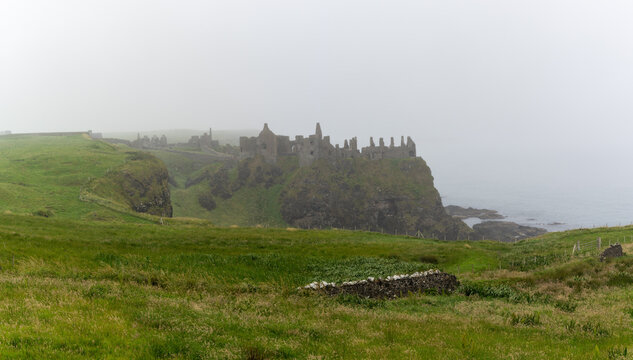 View Of Dunluce Castle In Thick Fog On The Causeway Coastal Route