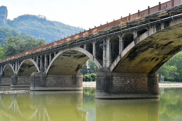 Fototapeta na wymiar a traditional Chinese style arch bridge on the river