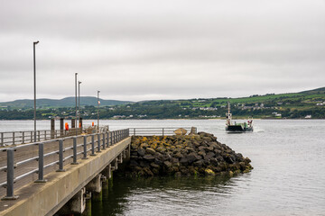 the Lough Foyle Ferry arriving at the pier at Magilligan Point from Ireland