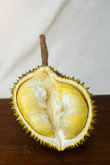 The Durian fruit cut open to reveal fleshy inside. Durian is known as the king of fruit in Asia...
