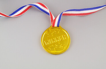 Gold medal with word winner on grey background	