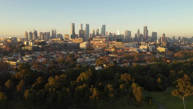 Melbourne city aerial at dawn with skyscrapers and trees, Victoria, Australia
