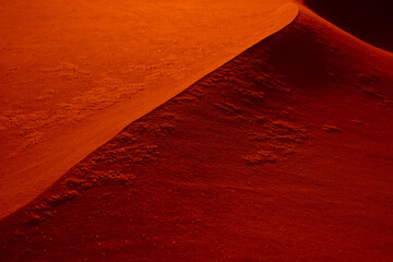 Abstract alien photo. Dune on the red planet. Background in red key. Red sand, abstract sand dune...