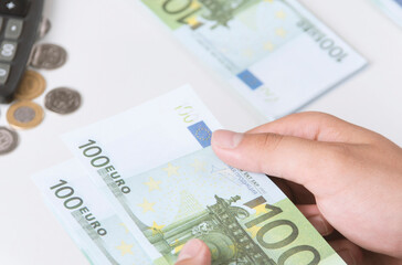 Man counting money, economy concept, allocation of money.Euro. Crisis after the covid-19 epidemic .Dollar falling or rising.