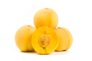 Yellow peach with half isolated on white background.