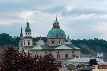 Fototapeta na wymiar The towers and the roof of Salzburg Cathedral in Salzburg, Austria
