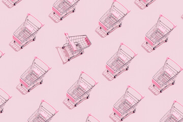 Pattern of supermarket shopping cart on pastel blue background. Creative design for packaging....