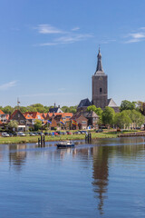 Fototapeta na wymiar River and tower of the Stephanus church in Hasselt, Netherlands