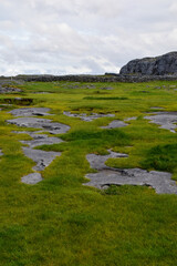 Fototapeta na wymiar Aran Islands irish landscape with houses, boats and a cemetery
