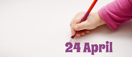 A child's hand writes 24 april in a lilac pencil. Banner with copy space