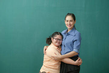 Portrait of Autism student kids and her teacher helping with lovely hug