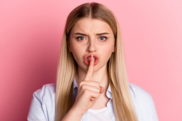 Fototapeta premium Photo of young pretty lady cover lips finger shh keep secret shut up isolated over pink color background