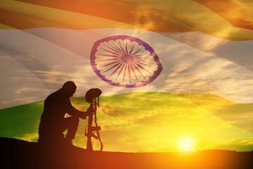 Silhouette of soldier kneeling with his head bowed against the sunrise or sunset and India flag. Greeting card for Independence day, Republic Day. India celebration.