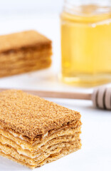 Honey layered cake or russian cake Medovik on white background. Close up view