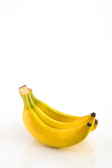 bunch of banana fruit with spots isolated on white background