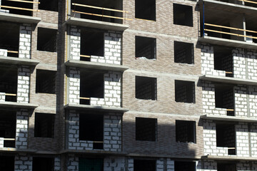 Building in city. Architecture details. Lots of windows in house.