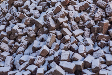 A pile of rocks under the snow.