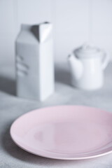 White kitchenware on grey background
