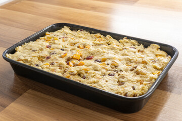 cake with dried fruits on a wooden surface. food concept