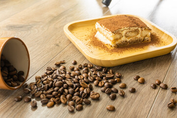 teramisu in a wooden bowl. food concept.coffee beans