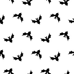 Halloween seamless pattern with black flying bat silhouettes on a white background