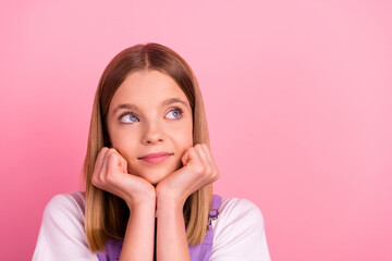 Picture of lovely cute young lady look empty space brainstorming create ideas isolated on pink color background